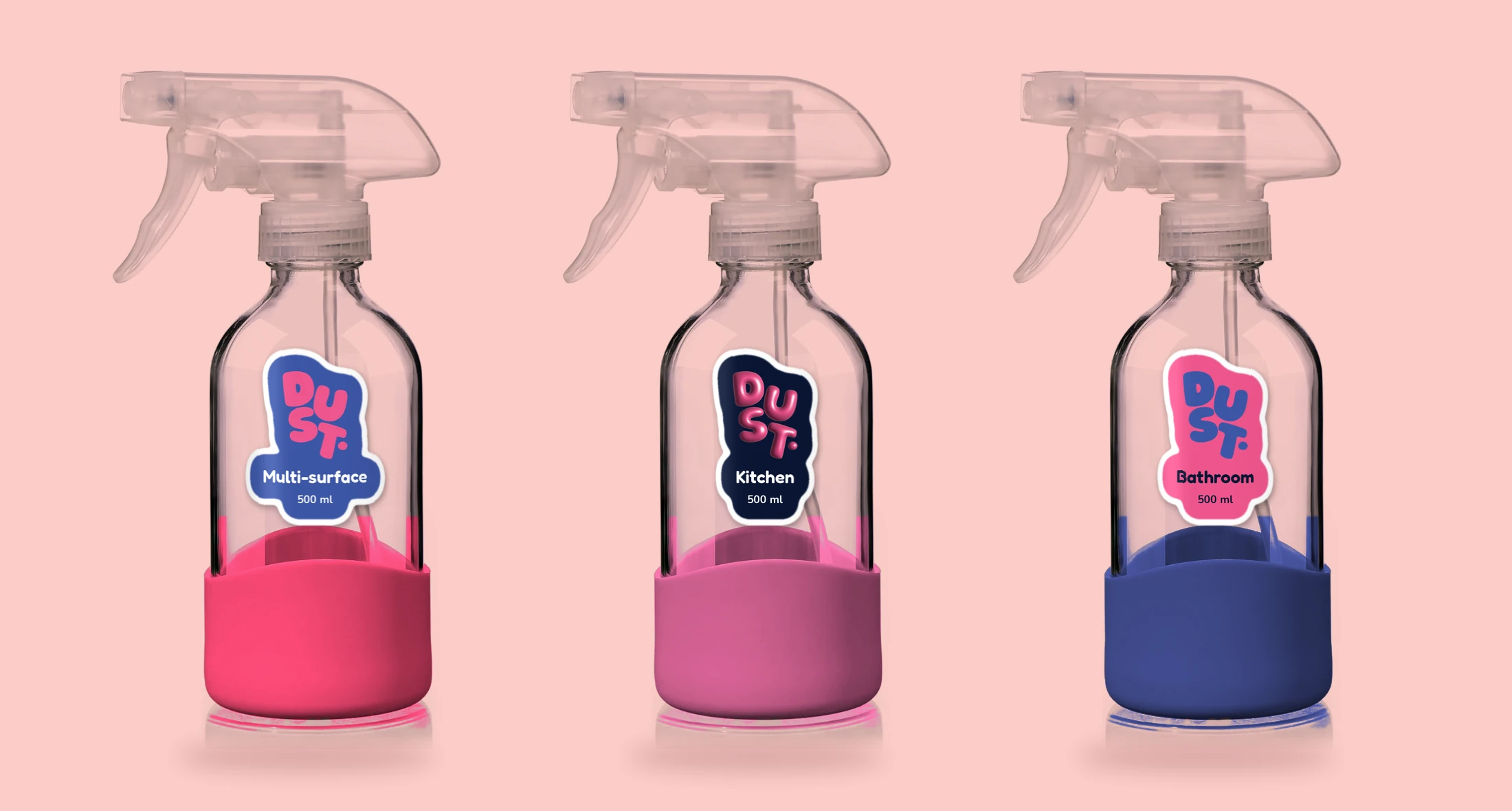 Three glass DUST spray bottles with coloured sleeves and labels: Multi-surface, Kitchen and Bathroom