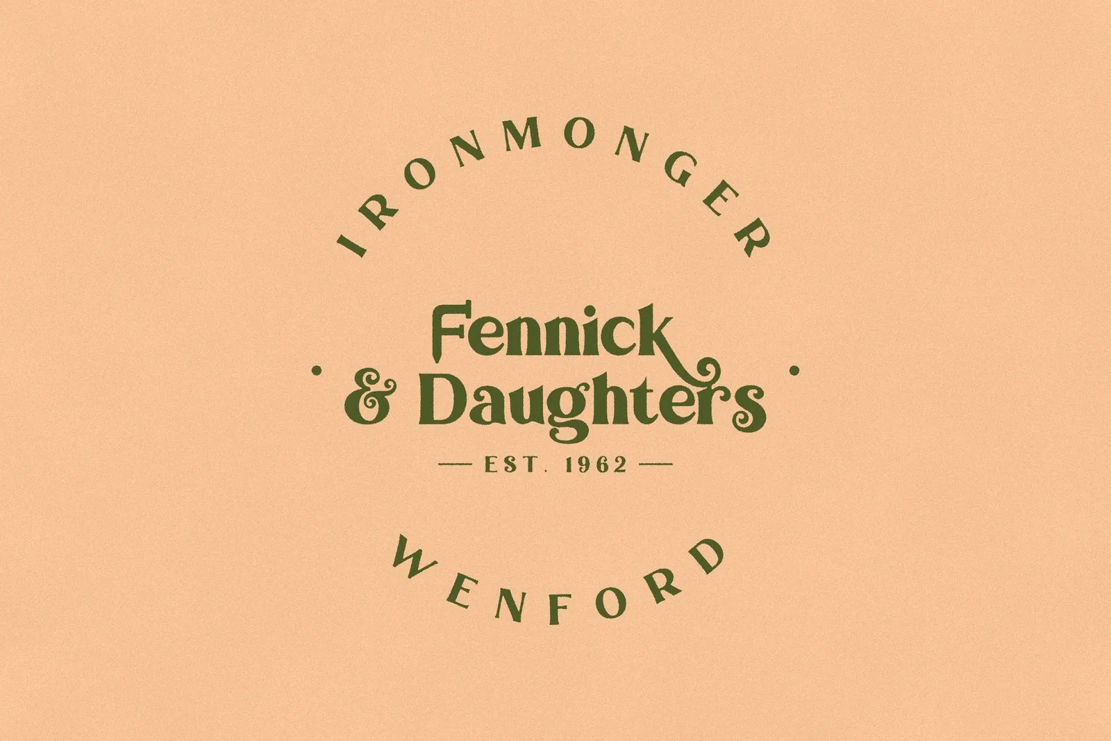 The badge printed in olive on peach paper: IRONMONGER over the top, WENFORD underneath, and the logo with EST. 1962 in the middle